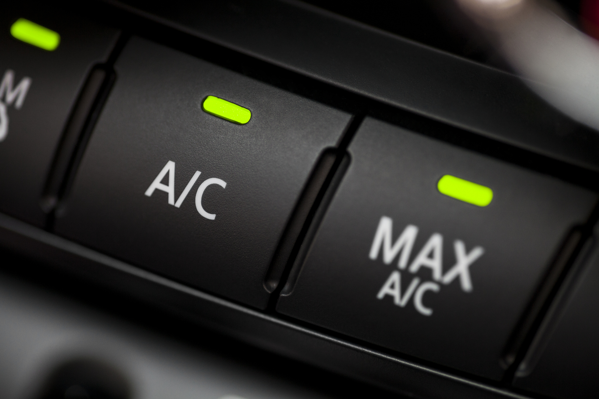 klimatyzacja-samochodowa Color detail with the air conditioning button inside a car.
** Note: Shallow depth of field